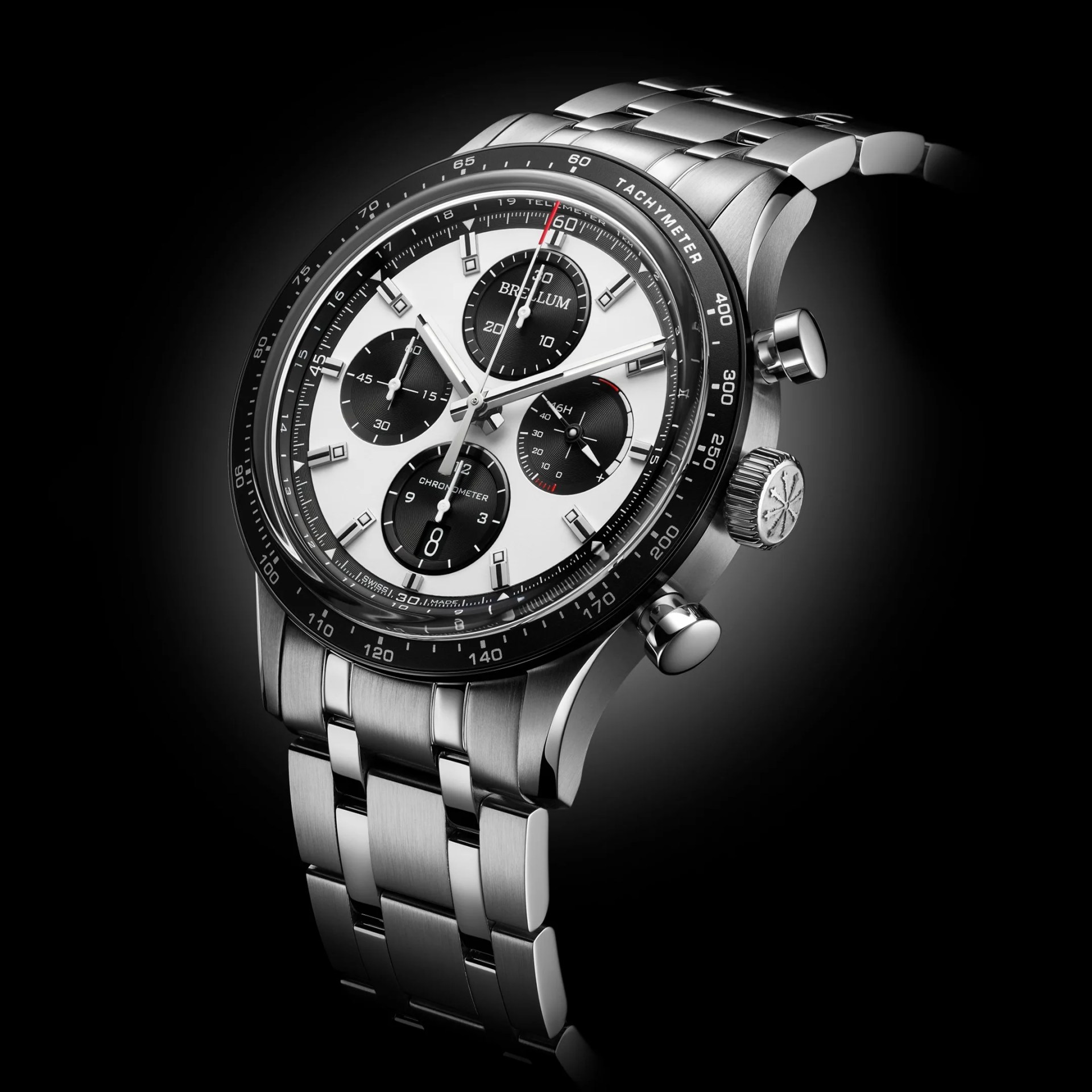 Stainless steel chronograph wristwatch with black and white dial and tachymeter bezel on a metal bracelet.