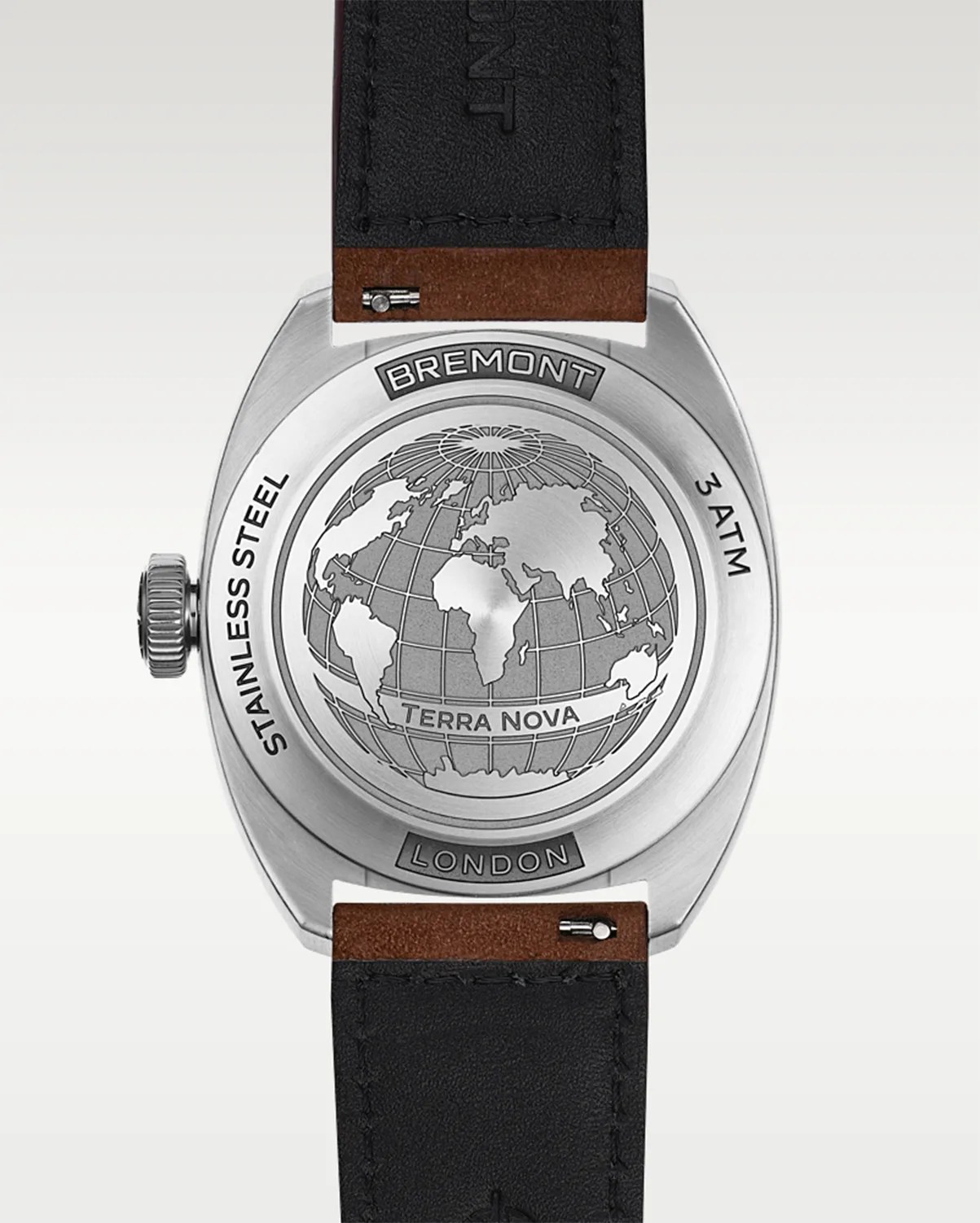Back of a stainless steel Bremont Terra Nova watch with engraved globe design and black leather strap.