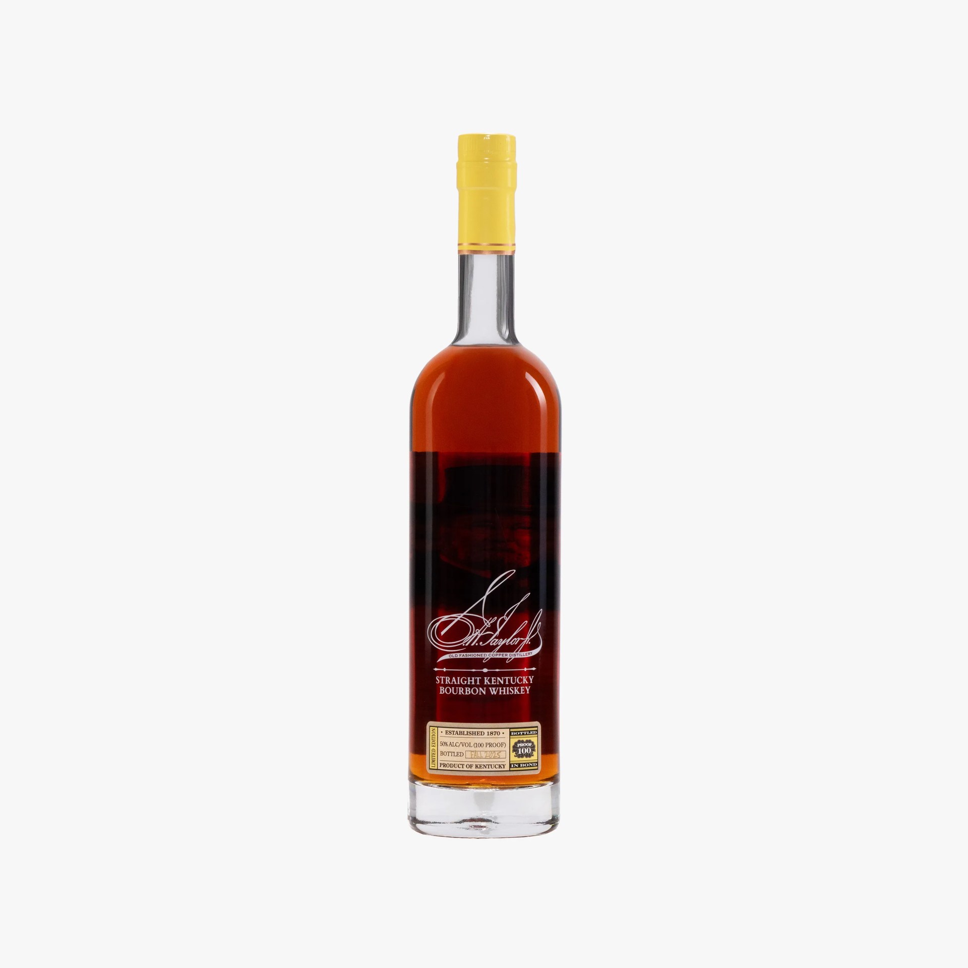 Tall clear glass bottle of straight Kentucky bourbon whiskey with yellow cap and white and gold label.