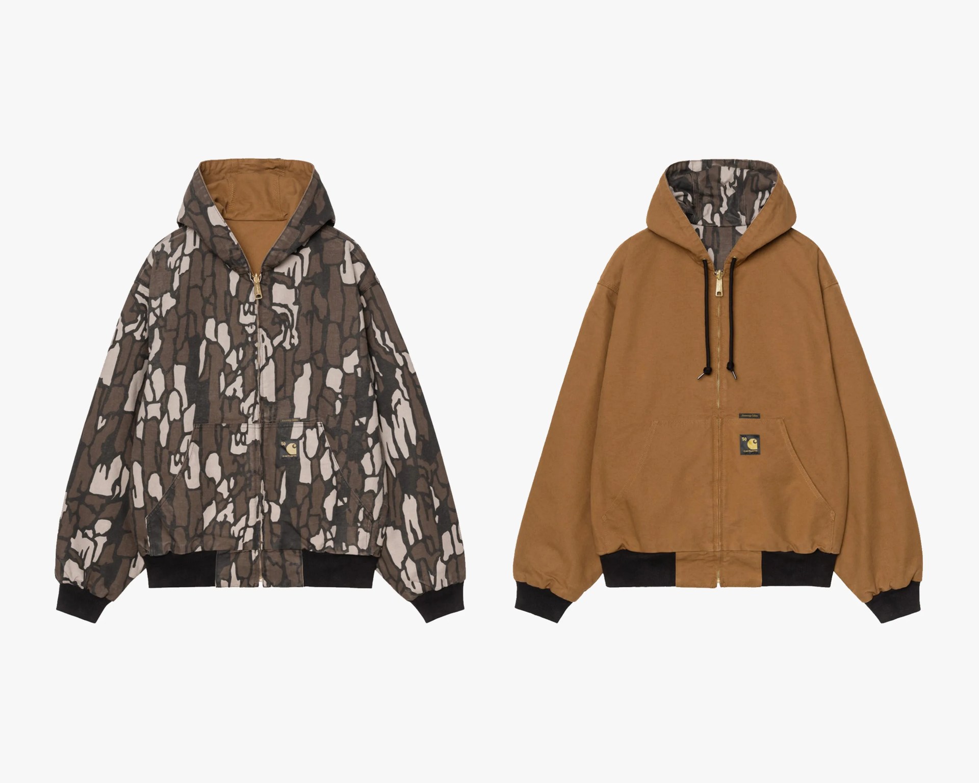 Two hooded zip-up jackets, one with brown and beige abstract camouflage pattern and black cuffs, the other solid brown with black cuffs and camouflage hood lining.