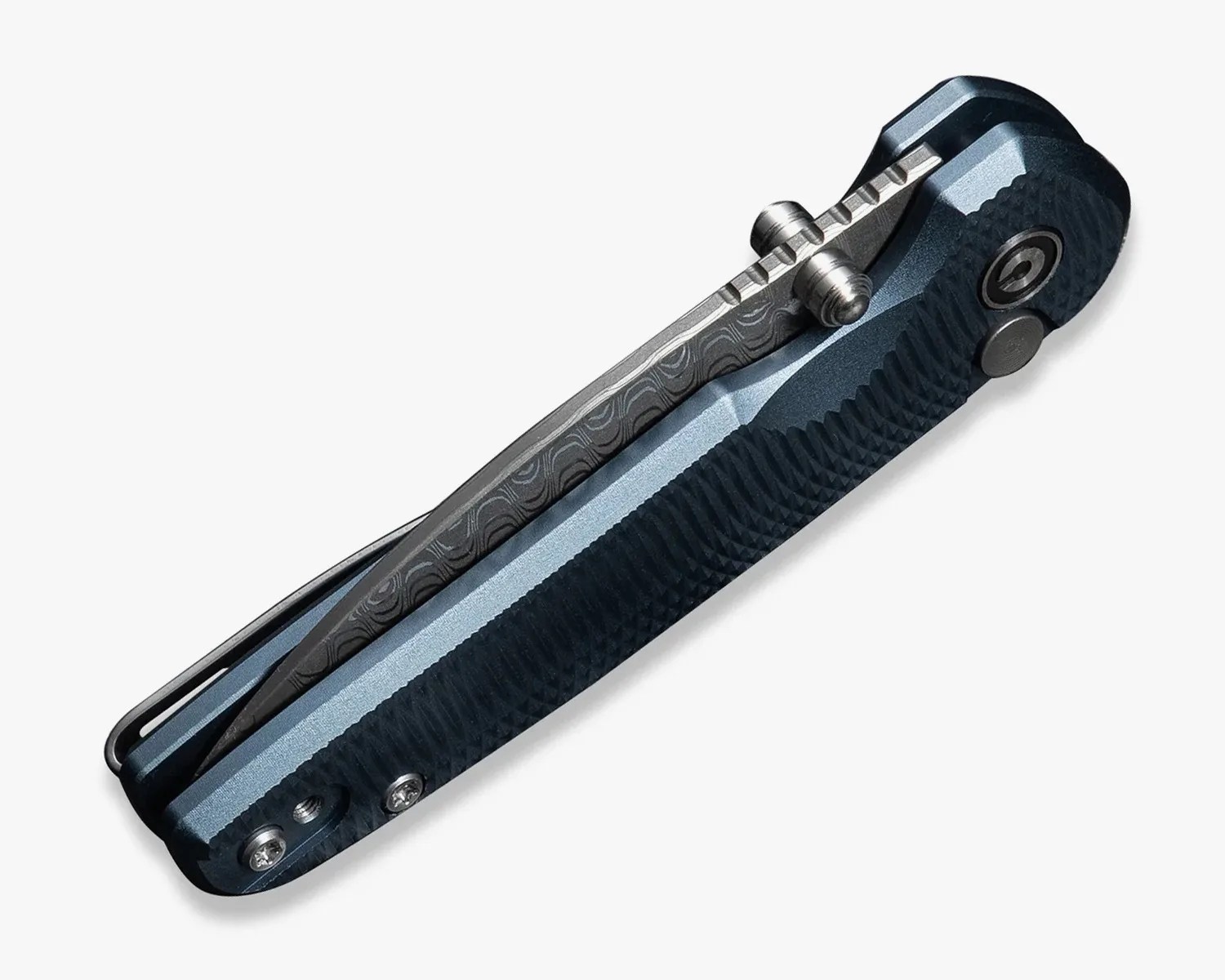 Folded blue and black textured folding knife with a patterned metal clip and thumb studs.