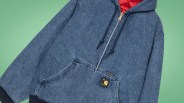 Blue denim zip-up hoodie with front pocket and red quilted lining visible inside the hood.