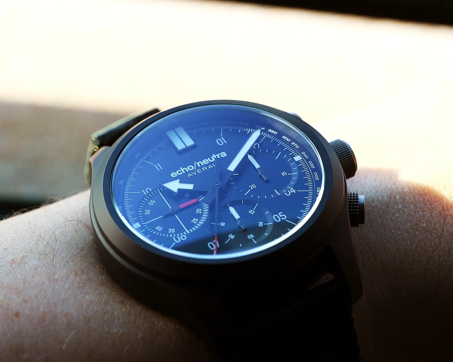 Black Echo Neutra AVERAU wristwatch with chronograph subdials worn on a wrist in natural light.
