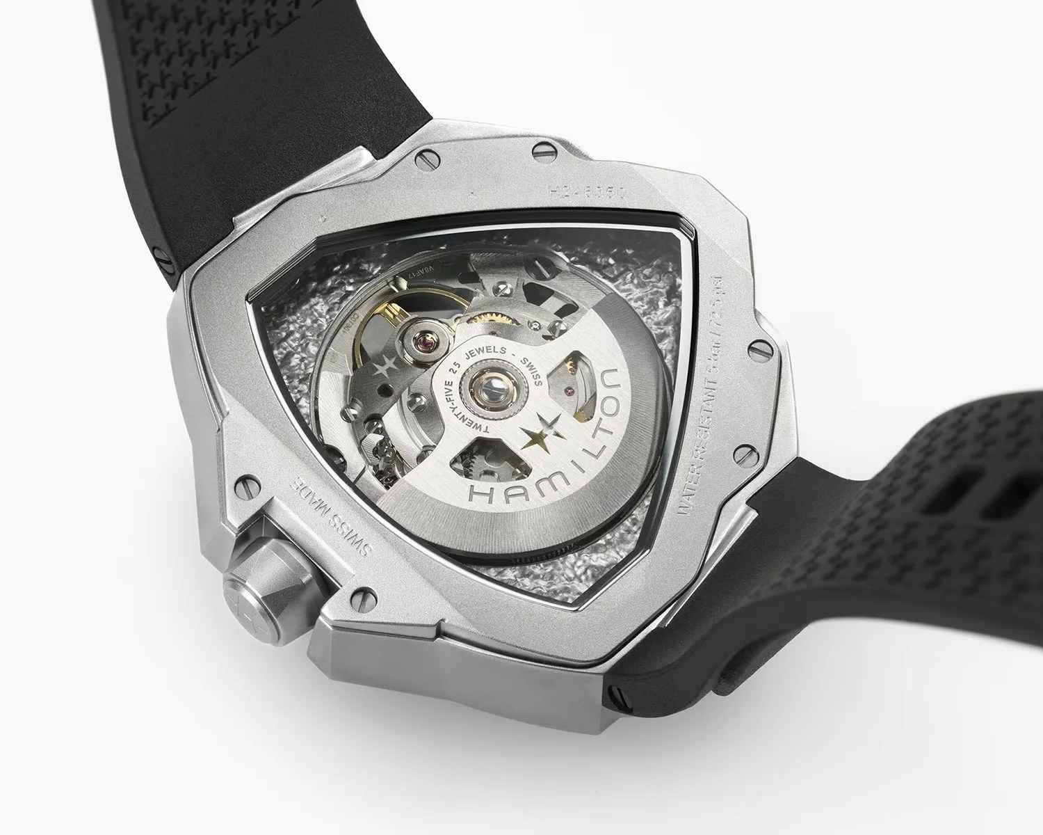 Back of a Hamilton watch with visible automatic movement and black rubber strap.
