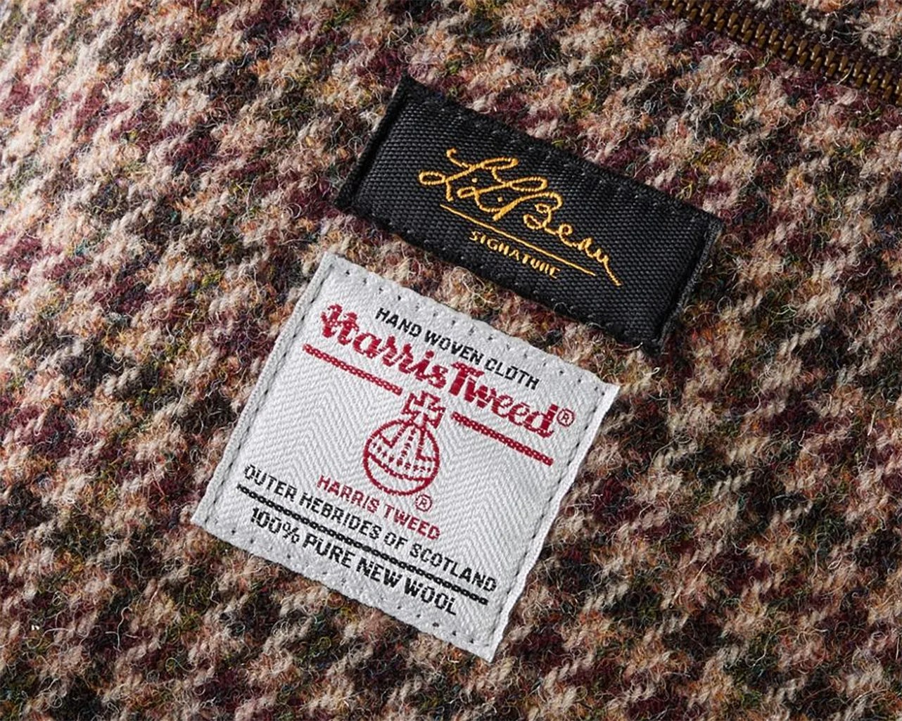 Close-up of a brown and beige Harris Tweed wool fabric with Lee Berman Signature and Harris Tweed labels.