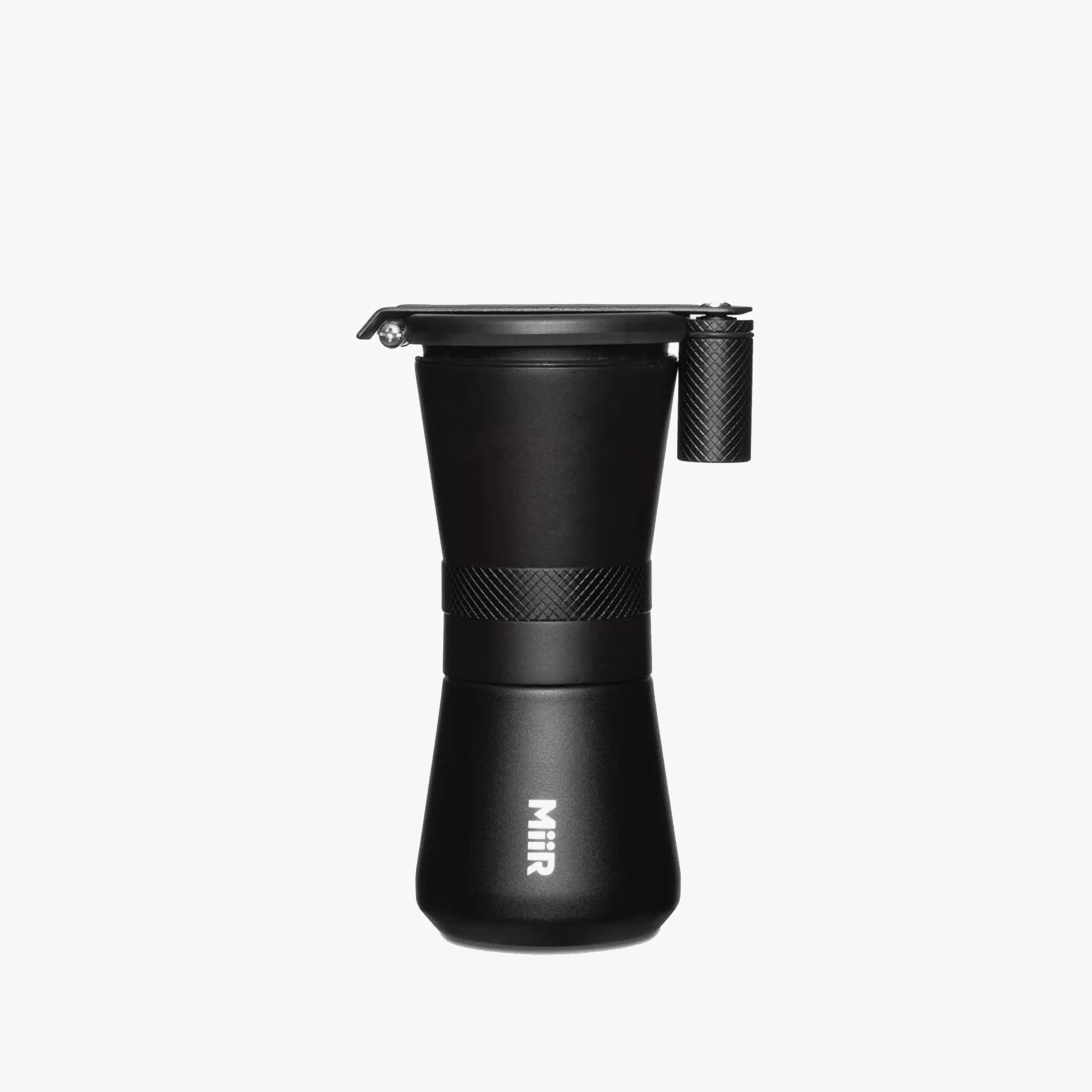 Black Miir manual coffee grinder with textured grip and foldable handle on a white background.