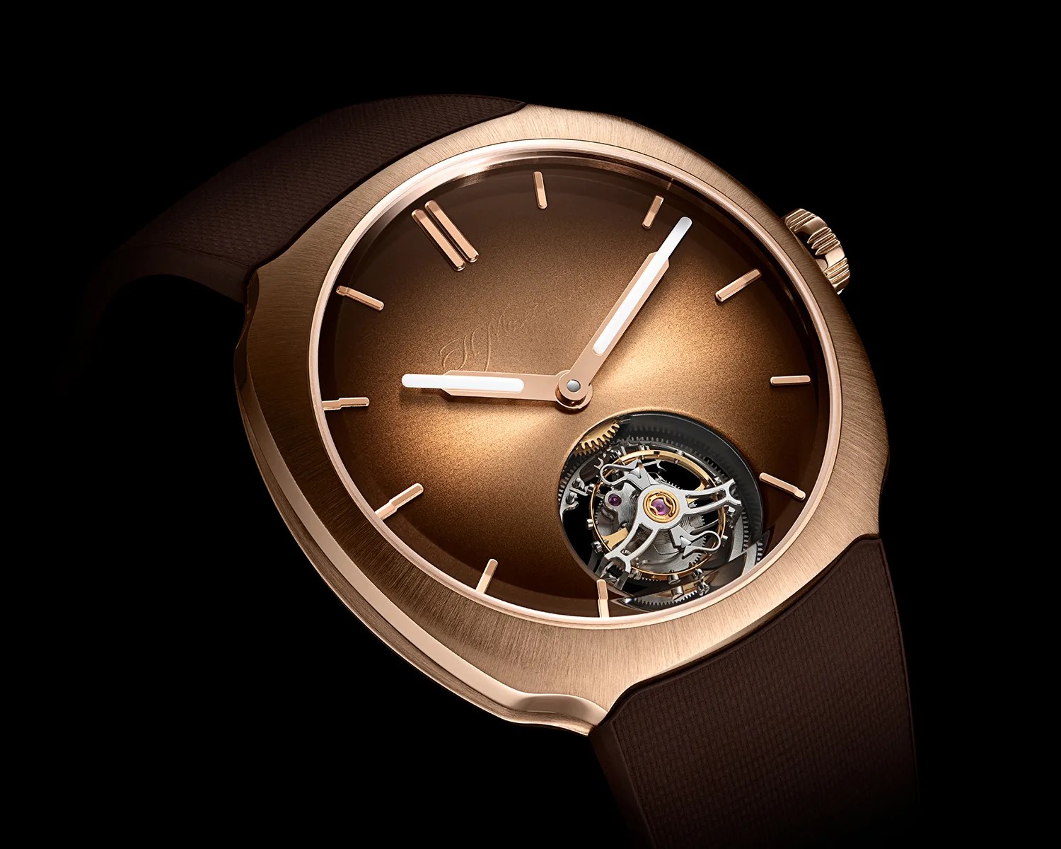 Rose gold wristwatch with a brown gradient dial, minimal hour markers, and an exposed tourbillon mechanism.