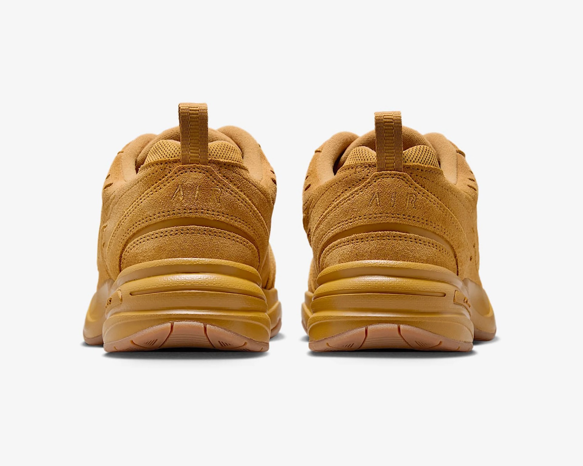 Pair of wheat-colored suede sneakers shown from the back with "AIR" embossed on the heel tabs.