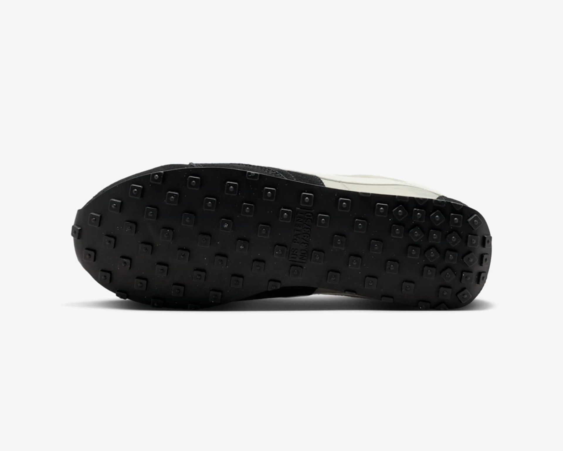 Black rubber shoe sole with square studs and patent number embossed in the center.
