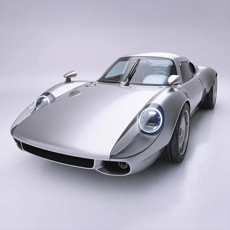 Silver vintage sports car with round LED headlights and aerodynamic body on a white studio floor.