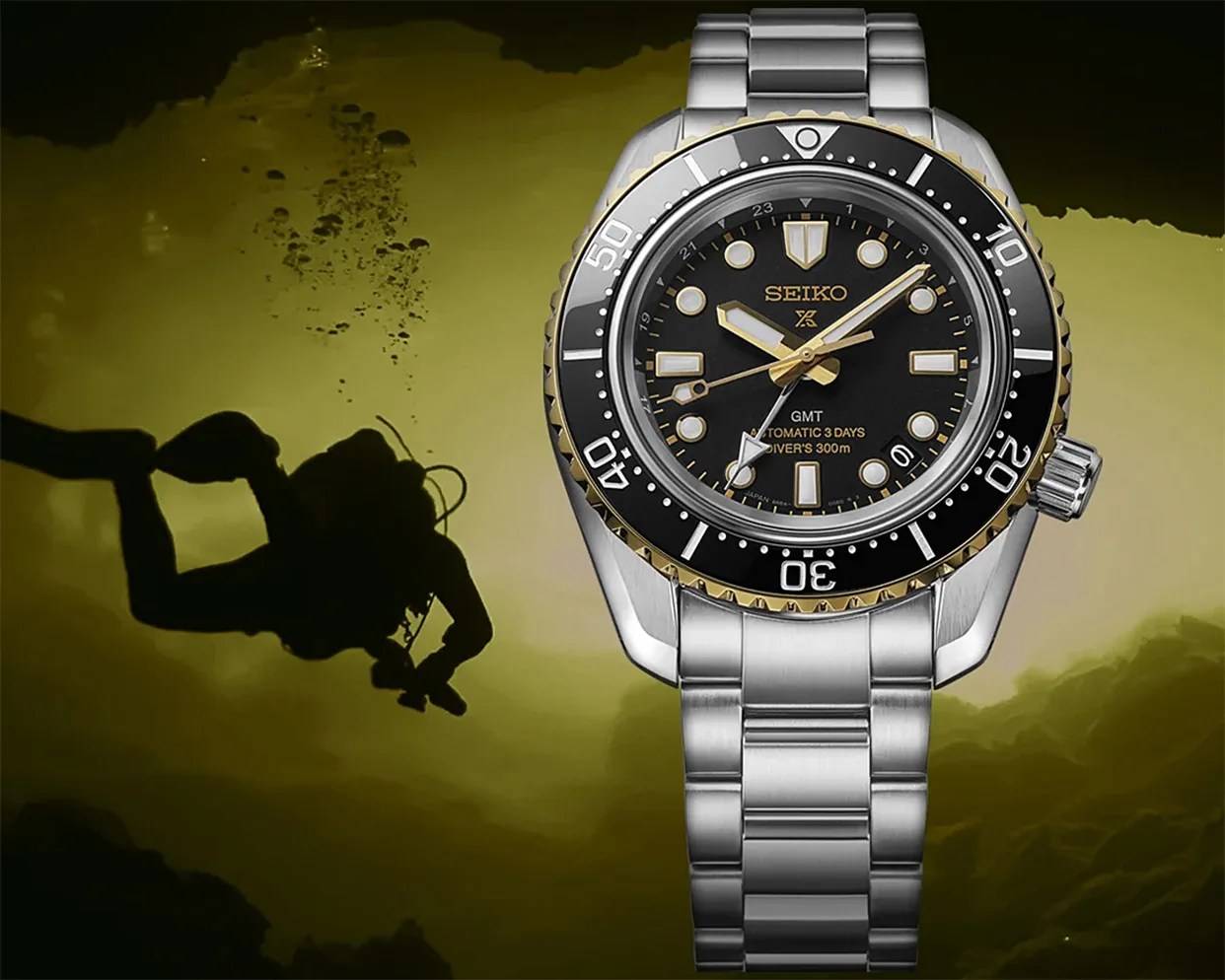 Silver Seiko dive watch with black and gold bezel and black dial showing GMT and 300m water resistance, over underwater diver background.