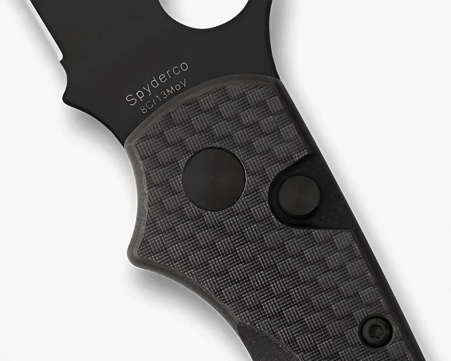 Close-up of a black Spyderco knife handle with textured grip and visible screws.