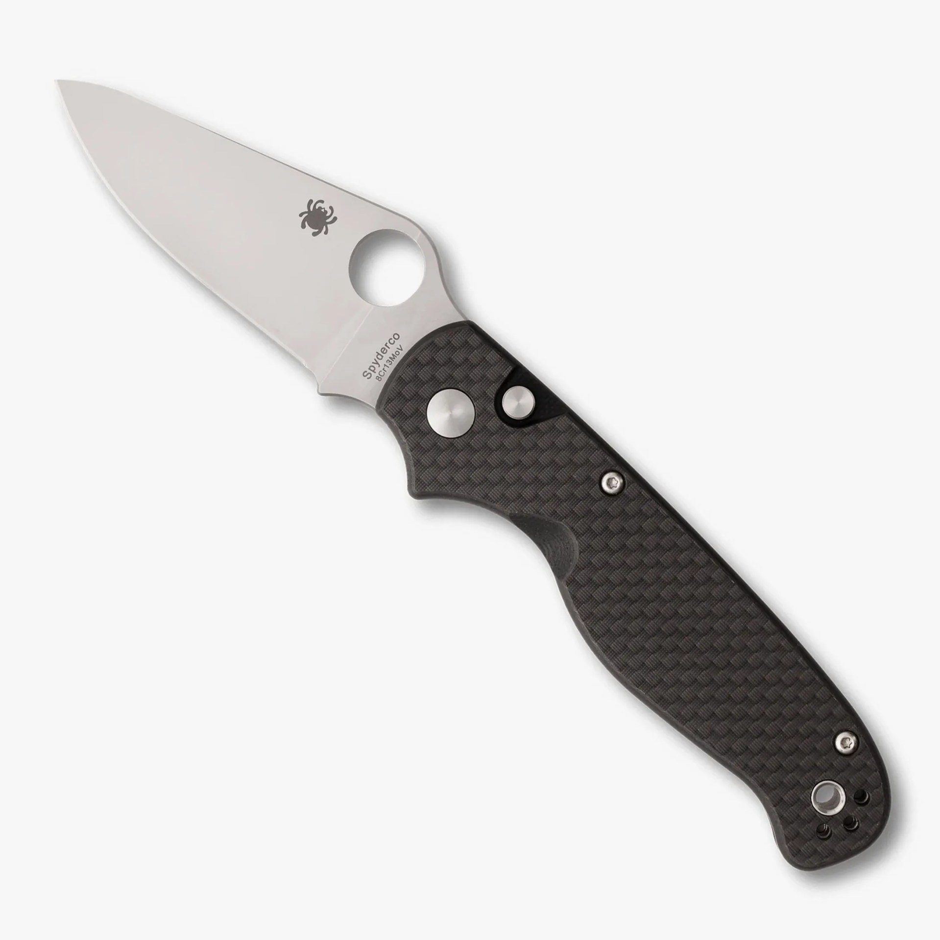 Folding knife with a silver blade and textured black handle featuring a circular thumb hole near the blade base.