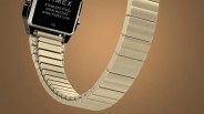 Gold-tone stainless steel watch band with brushed finish and rectangular links.
