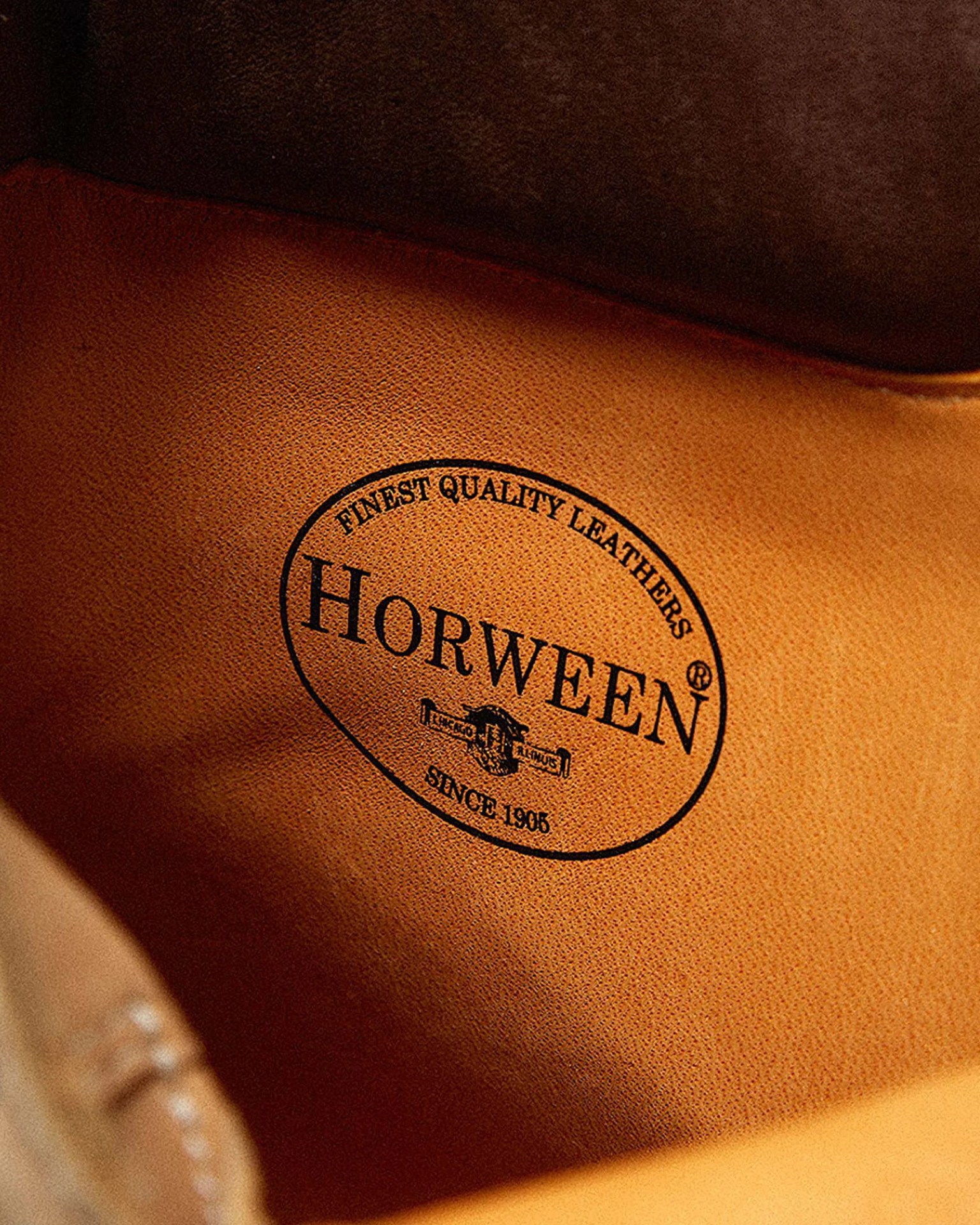 Close-up of tan leather with black "Horween Finest Quality Leathers Since 1905" logo stamped inside.