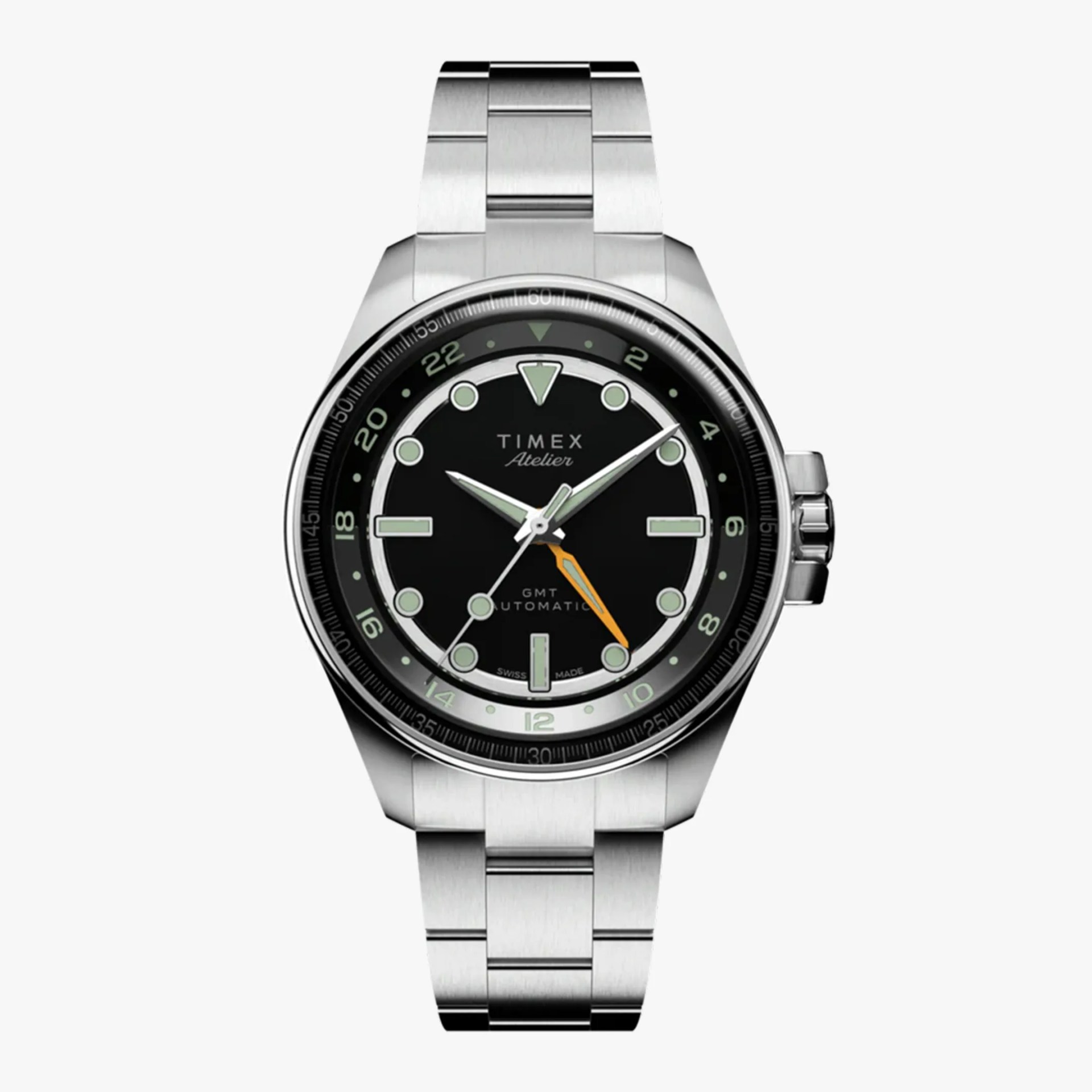 Silver stainless steel Timex Atelier GMT automatic watch with black dial and orange GMT hand.