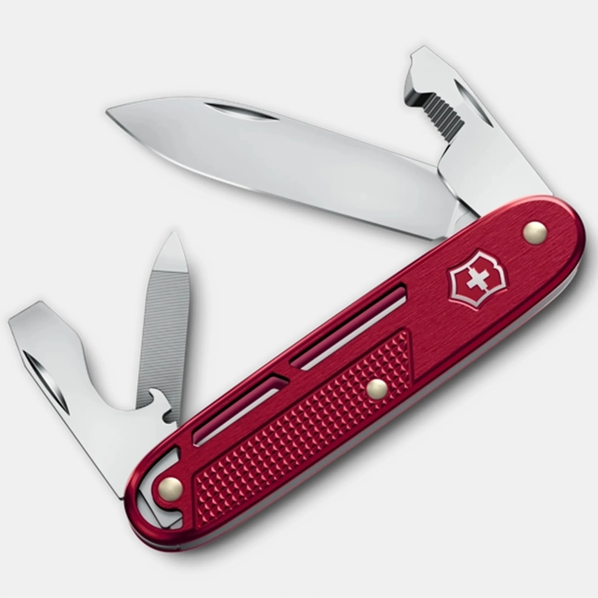 Red Swiss Army knife with multiple stainless steel tools extended, including a large blade, file, and bottle opener.