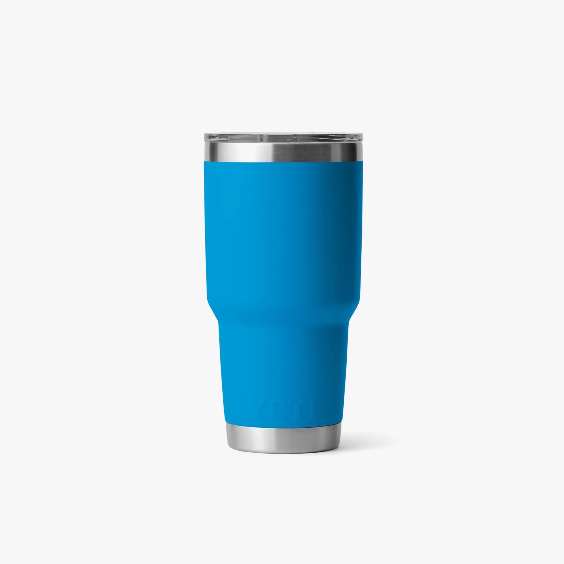 Blue stainless steel insulated tumbler with clear lid and silver rim on a white background.