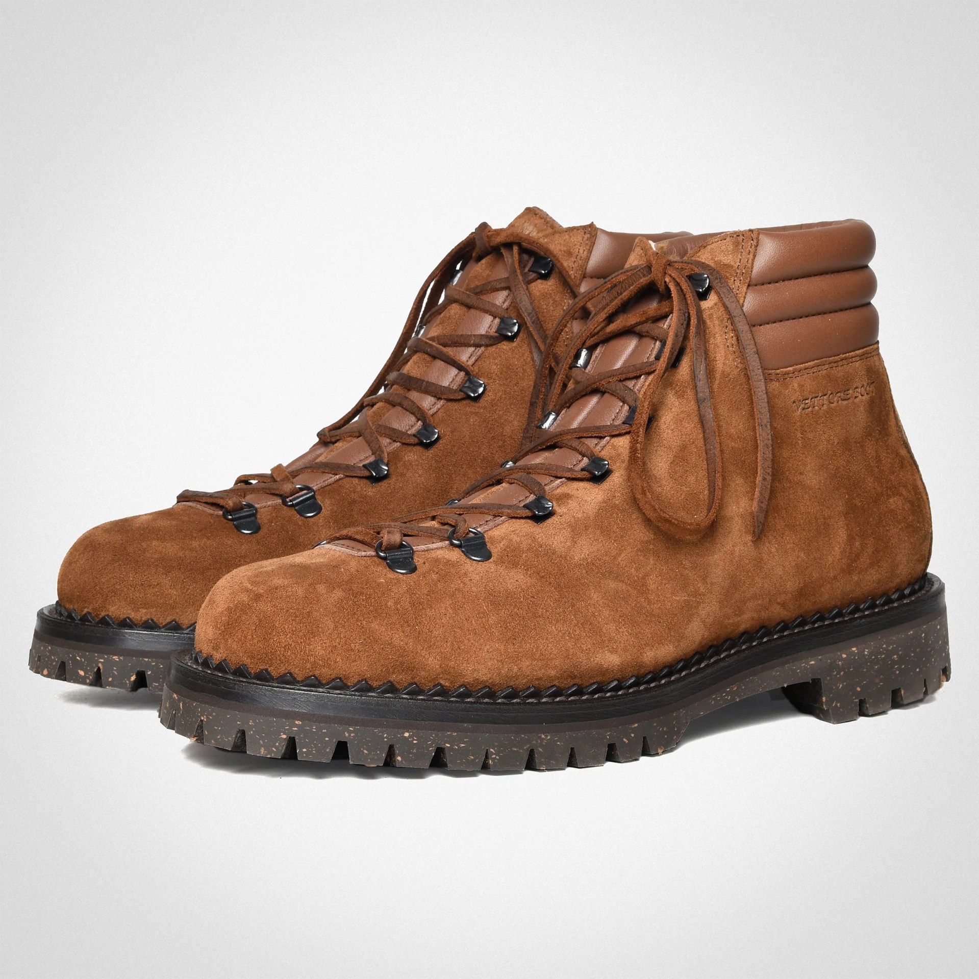 Pair of brown suede hiking boots with padded leather collars and black lug soles.