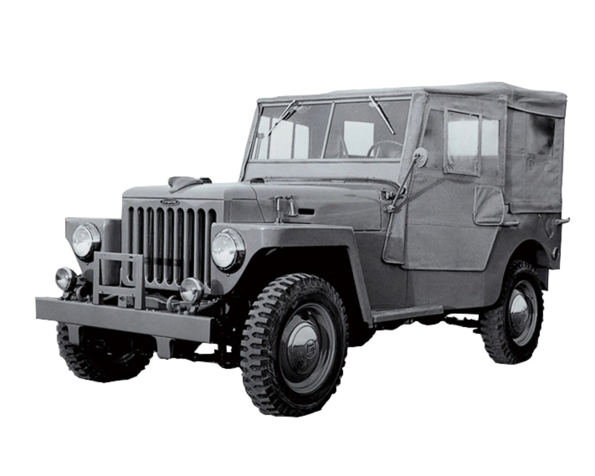 Vintage military-style off-road vehicle with canvas top and rugged tires.