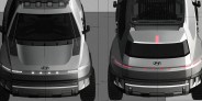 Top-down view of two silver Hyundai electric SUVs with LED light bars, parked side by side on a tiled surface.