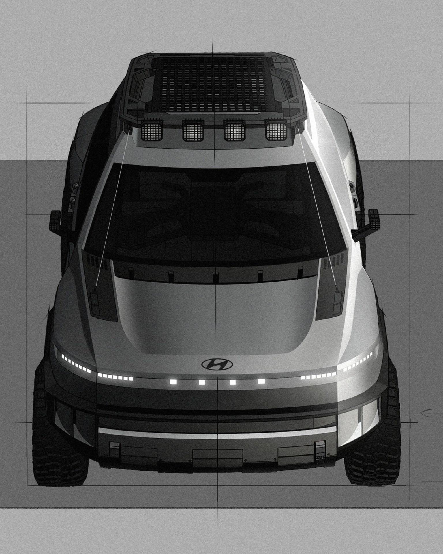 Top-down view of a silver Hyundai SUV with roof rack and off-road tires on a gray surface.