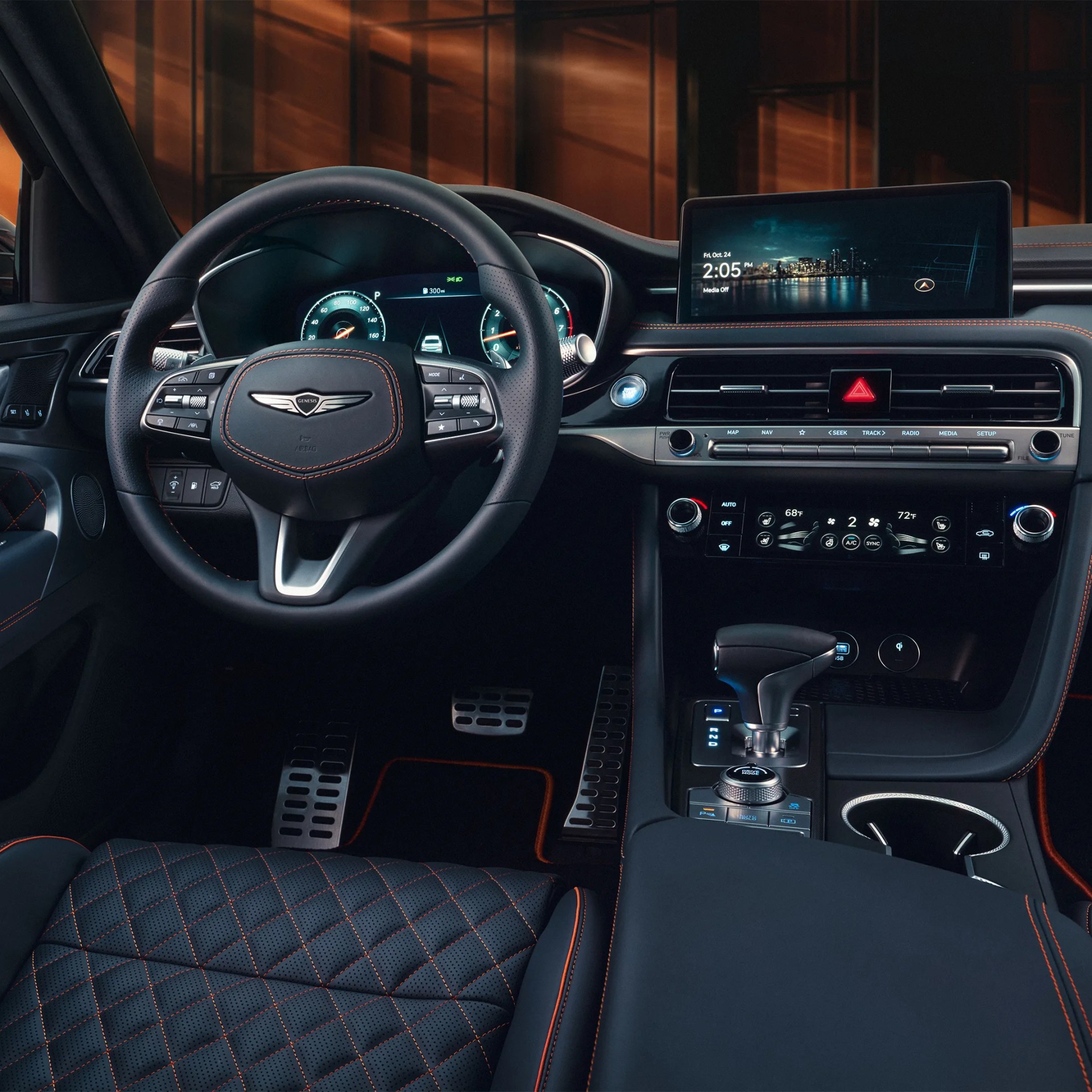 Luxury car interior with black leather steering wheel, digital dashboard, touchscreen display, and quilted leather seat with orange stitching.