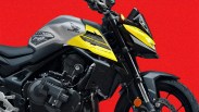 Close-up of a black and yellow Honda motorcycle front and engine area against a red background.