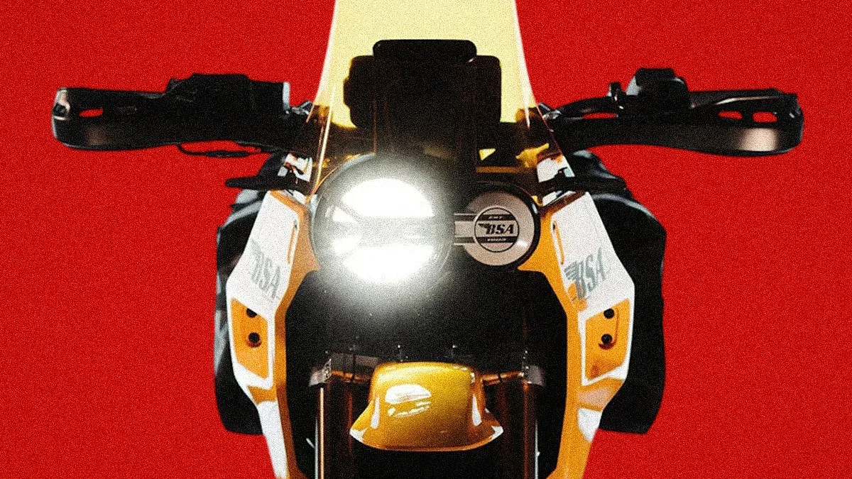 Front view of a yellow and white BSA motorcycle with its headlight on against a red background.