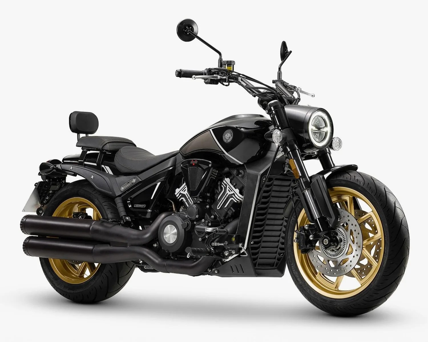 Black motorcycle with gold wheels, dual exhaust pipes, and a backrest on the seat.