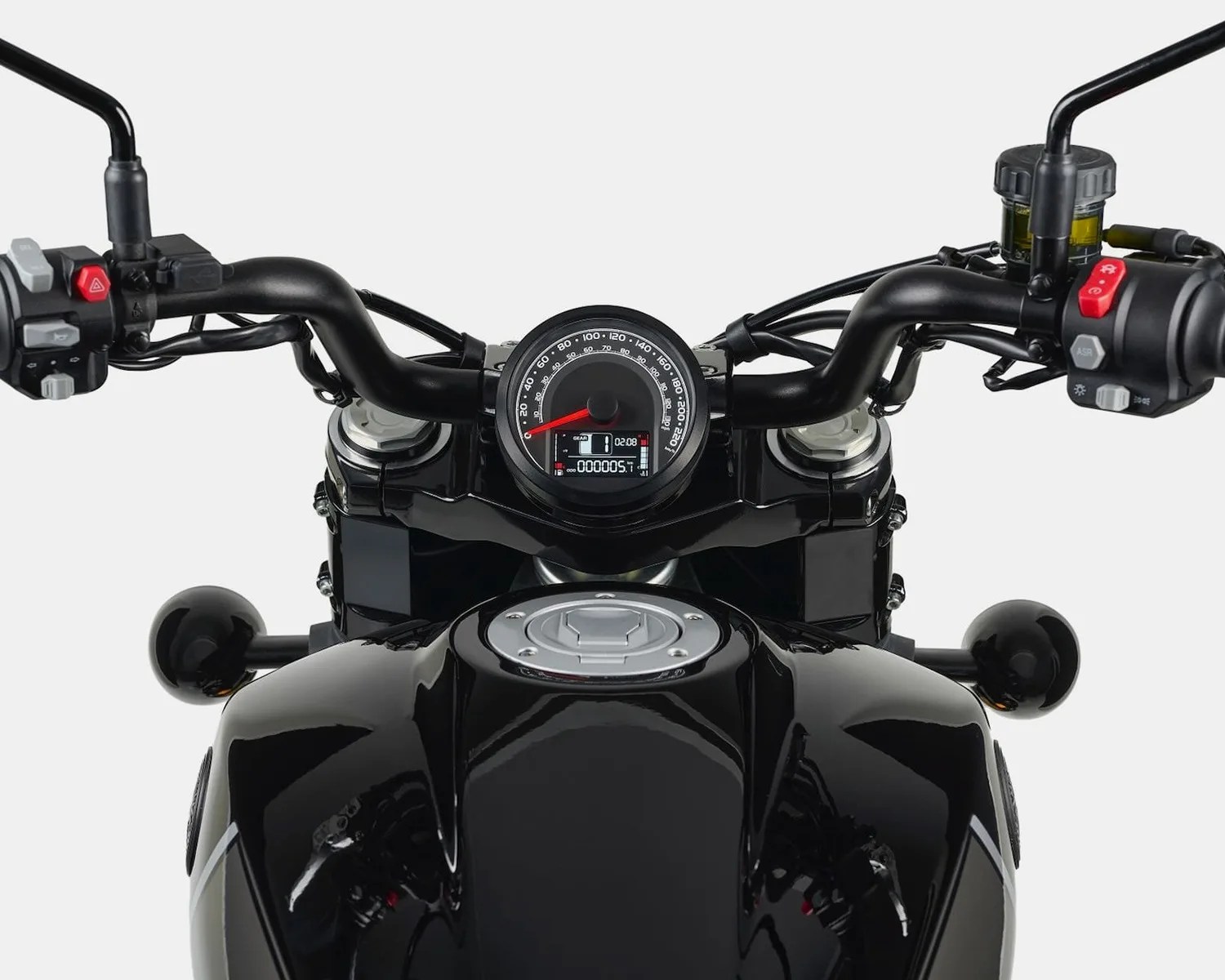 Black motorcycle dashboard with round speedometer, digital display, and black handlebars with control buttons.
