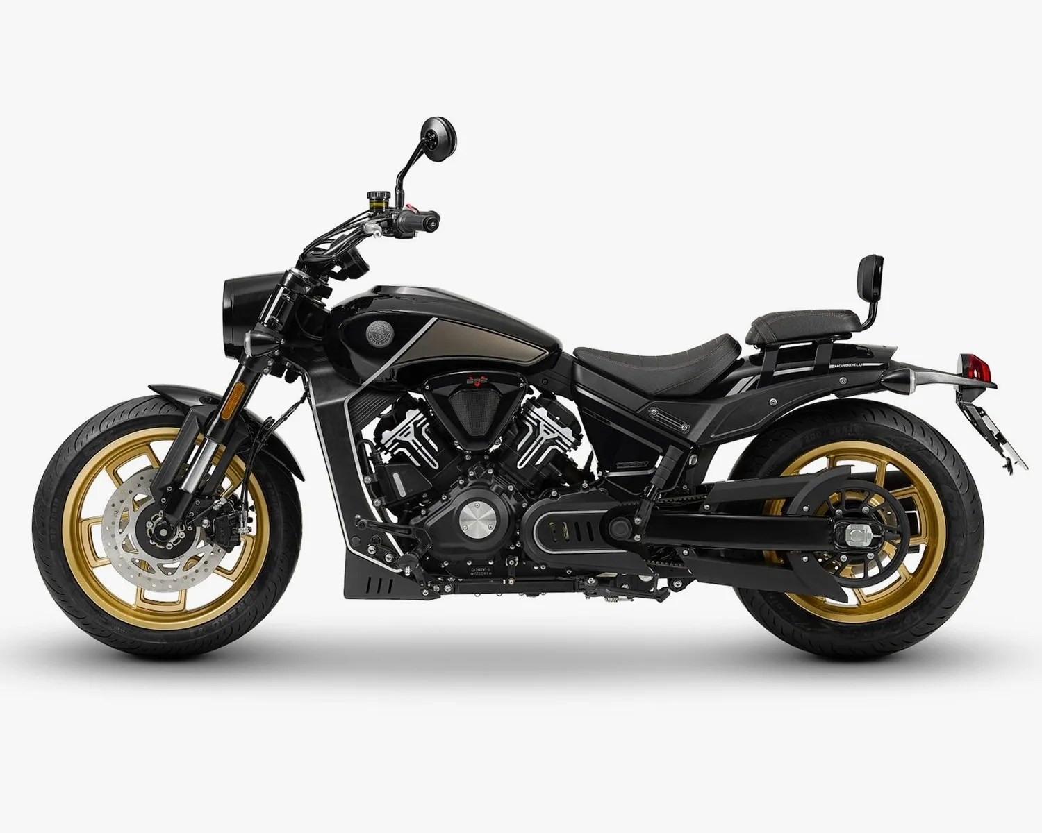 Black motorcycle with gold wheels, V-twin engine, and a small backrest on the rear seat against a white background.