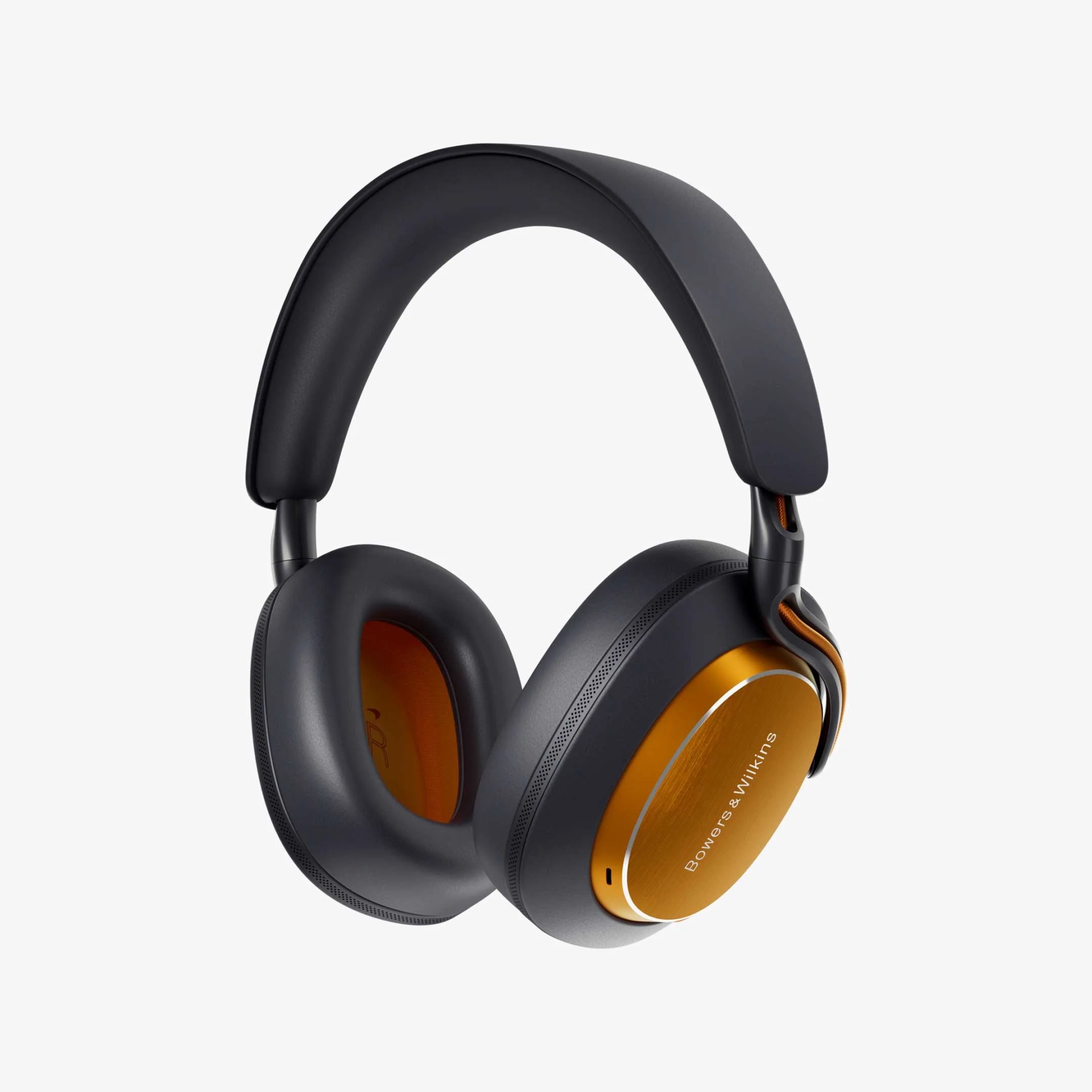 Black and orange Bowers & Wilkins over-ear headphones with cushioned ear pads and headband.