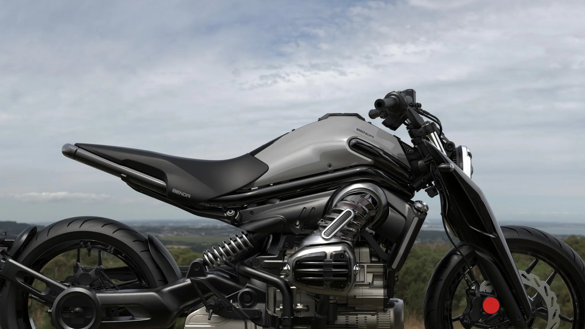Silver and black Benda motorcycle with exposed engine and black tires against a cloudy sky background.
