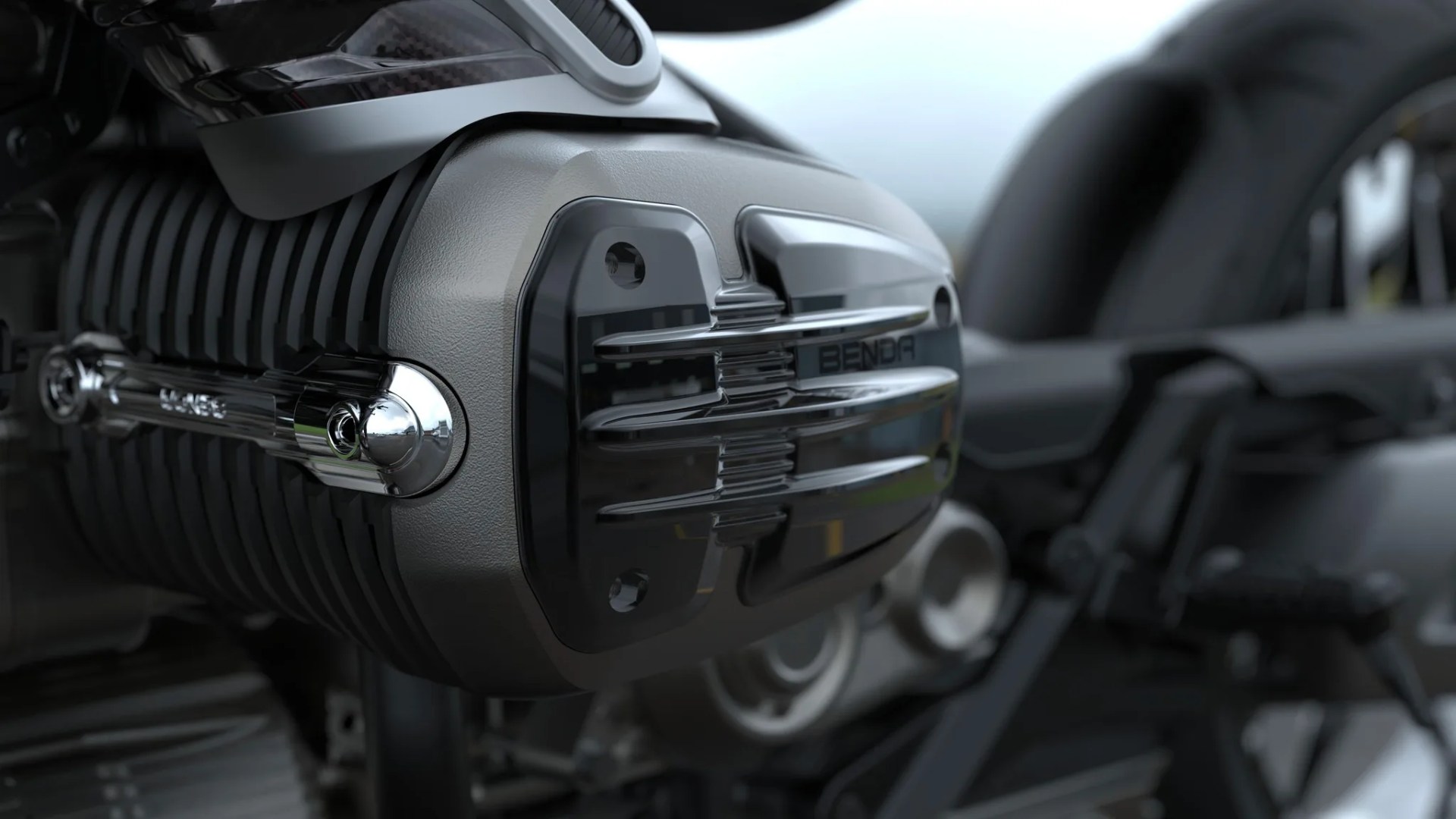 Close-up of a black and chrome motorcycle engine component with the word "BENDA" on it.