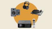 Compact gray audio system with display and remote, black over-ear headphones, gray bookshelf speakers, and a silver turntable.