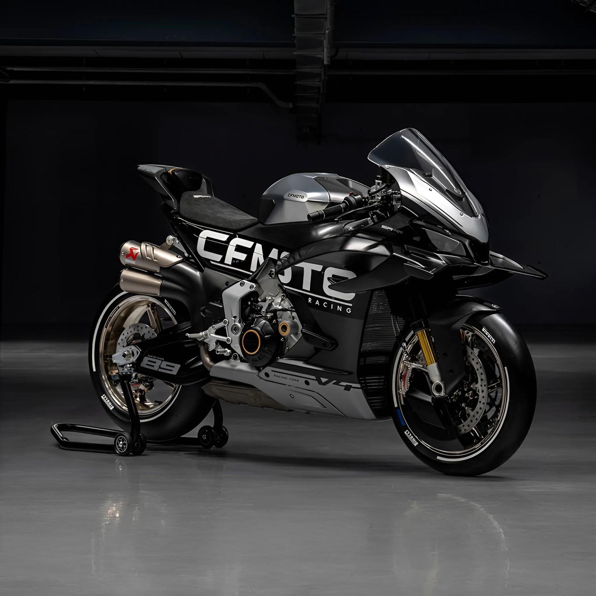 Black and silver CFMOTO racing motorcycle with gold rims and dual exhausts on a rear stand.