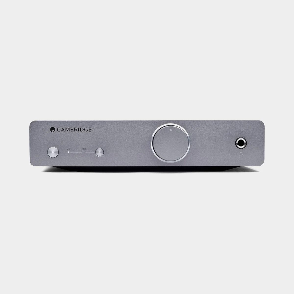 Gray Cambridge audio amplifier with two small buttons, a large central knob, and a headphone jack on the front panel.