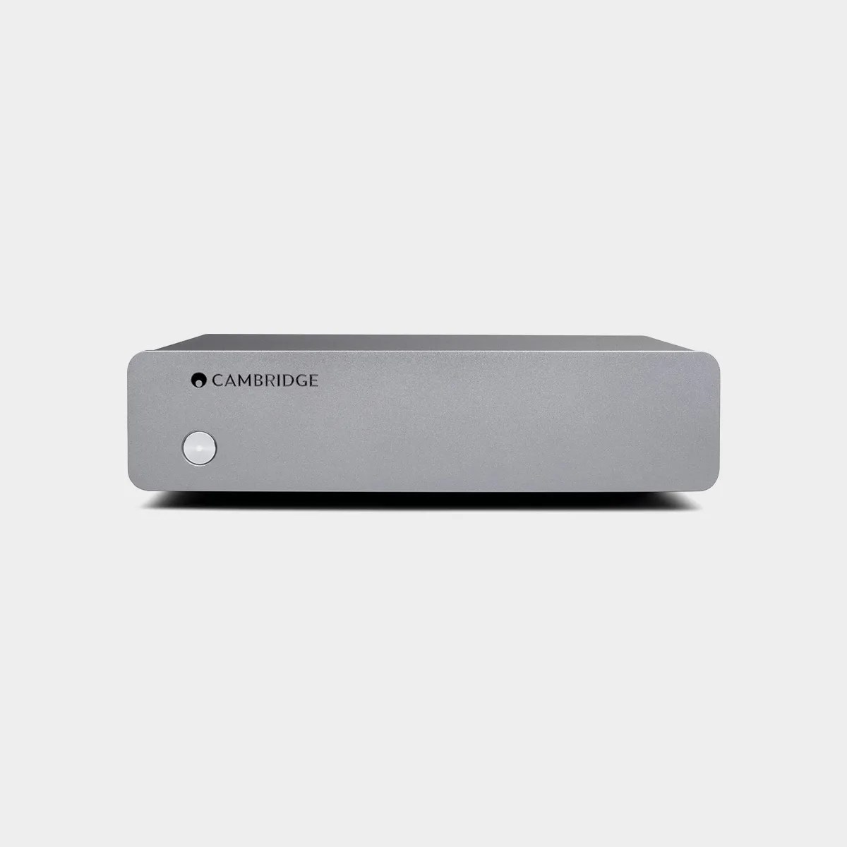 Silver Cambridge audio amplifier with a single round power button on the front left side.