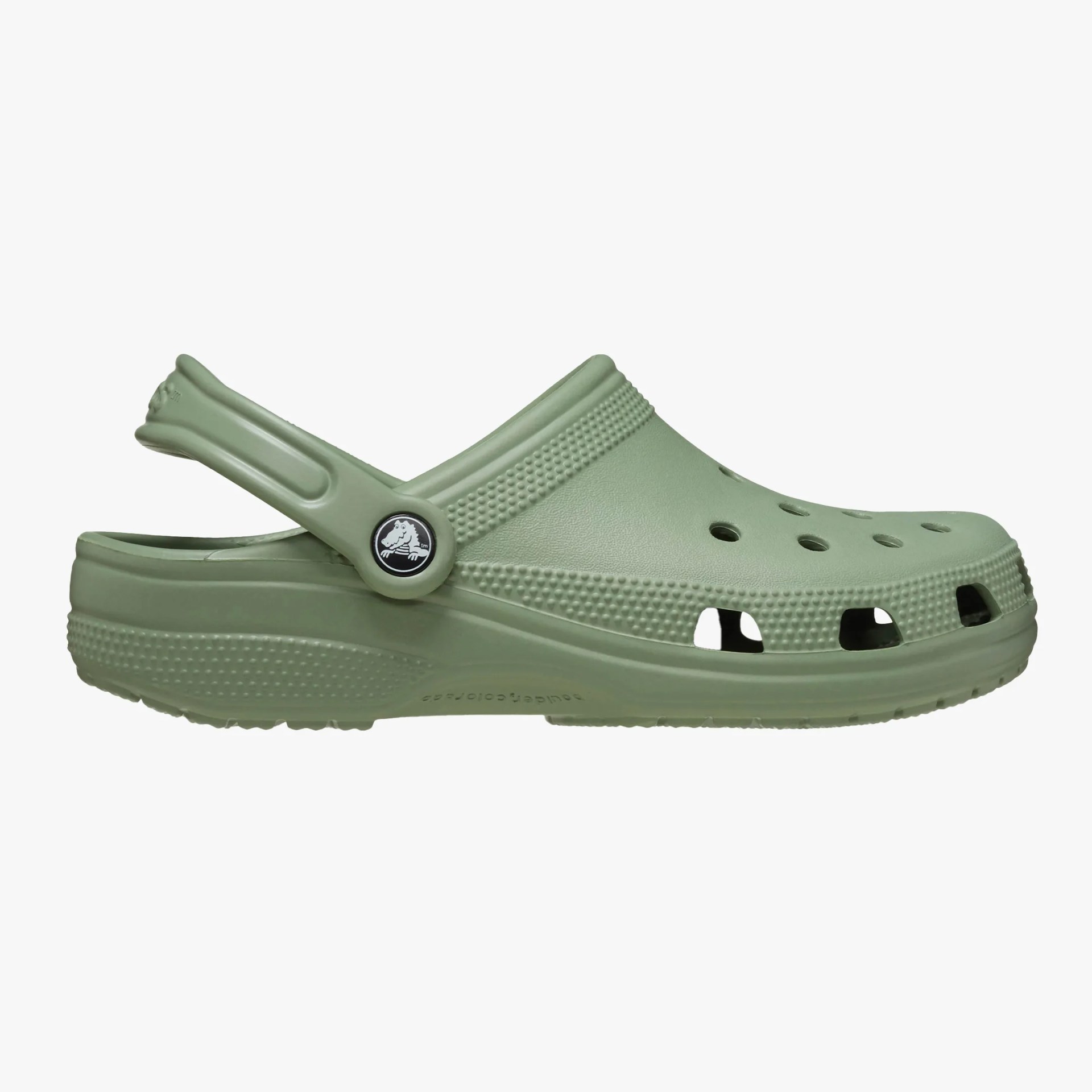 Light green Crocs clog with ventilation holes and a heel strap.