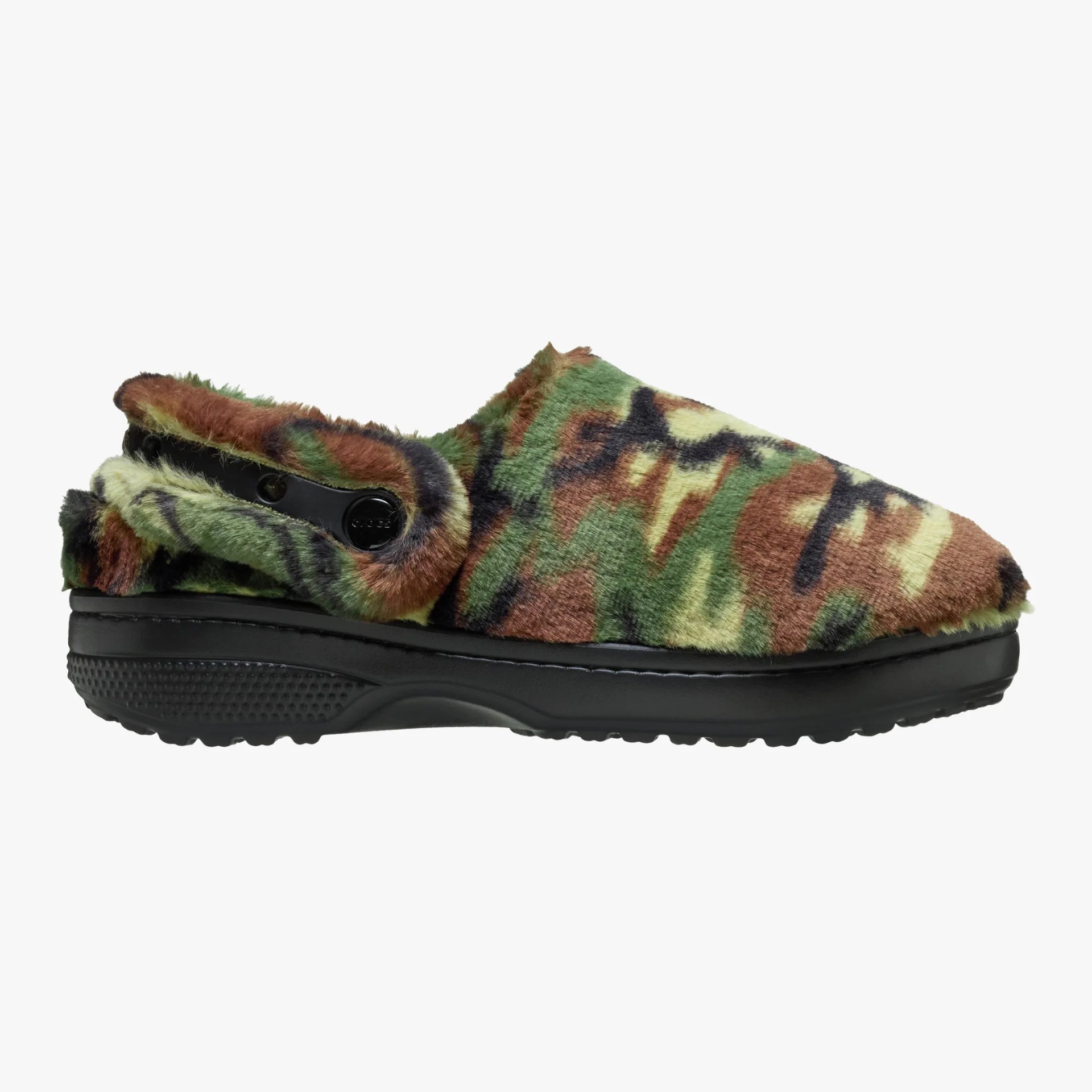 Fuzzy slip-on clog with green, brown, and black camouflage pattern and black sole.
