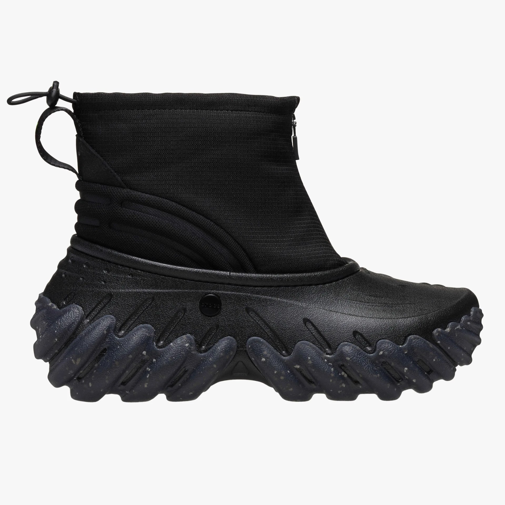 Black high-top boot with textured, wavy sole and zippered fabric upper.