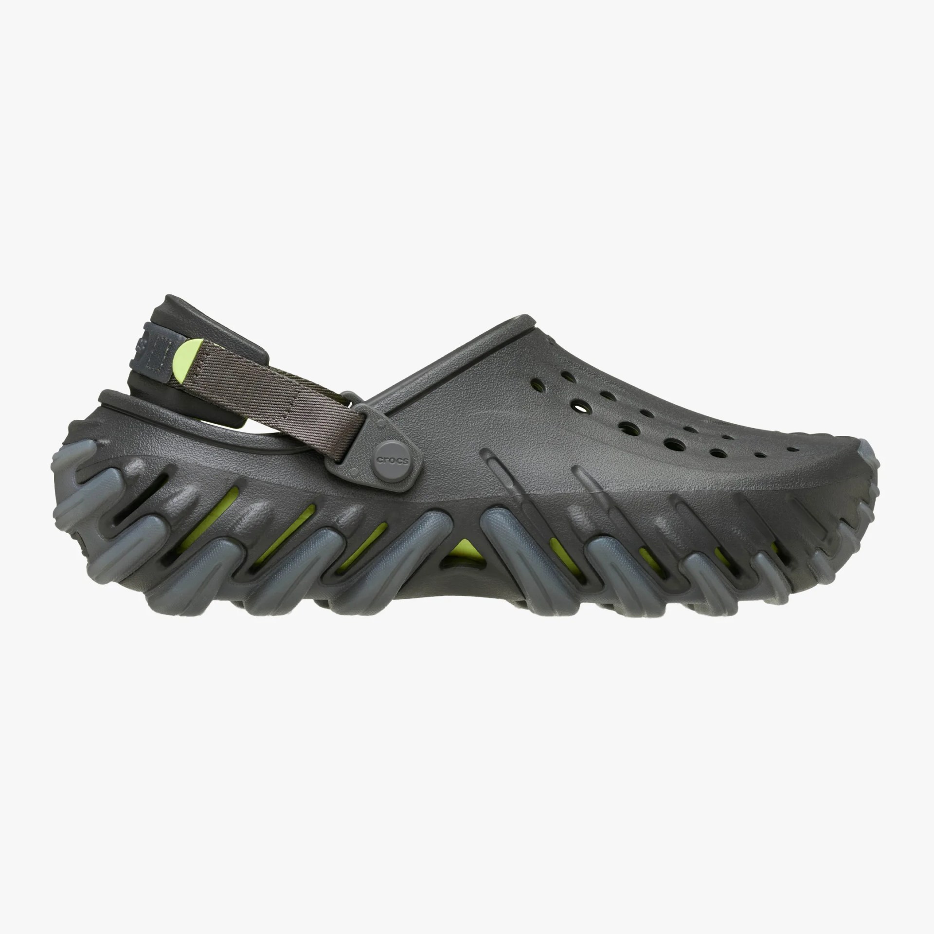 Dark gray Crocs clog with a rugged, thick sole featuring gray and lime green accents and an adjustable heel strap.