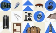 Pair of green studio monitor speakers on blue circle, white and blue Nike running shoe, black pizza oven with pizza inside, black wireless over-ear headphones on blue circle, black hard-shell suitcase with silver accents, silver multi-tool with pliers, black and silver drip coffee maker, silver and blue Timex wristwatch on blue circle, brown camping tent, wooden shelving unit, brown canvas and leather duffel bag, black AeroPress coffee maker with coffee dripping.
