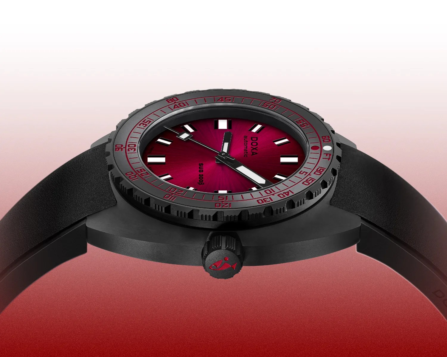 Black dive watch with a red sunburst dial, black bezel with red markings, and black rubber strap.