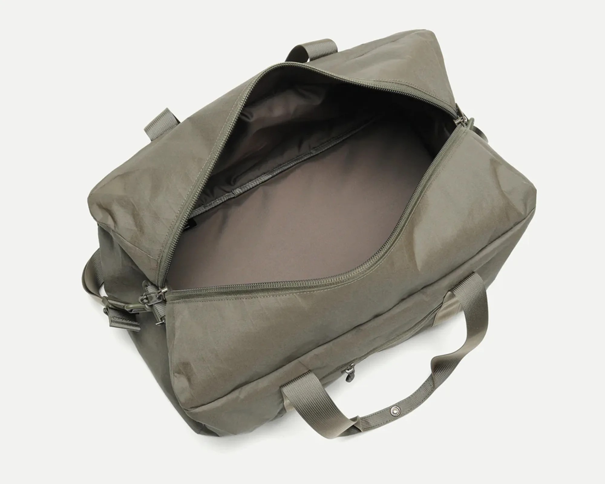 Olive-green rectangular duffel bag with dual handles and open zipper showing empty interior.