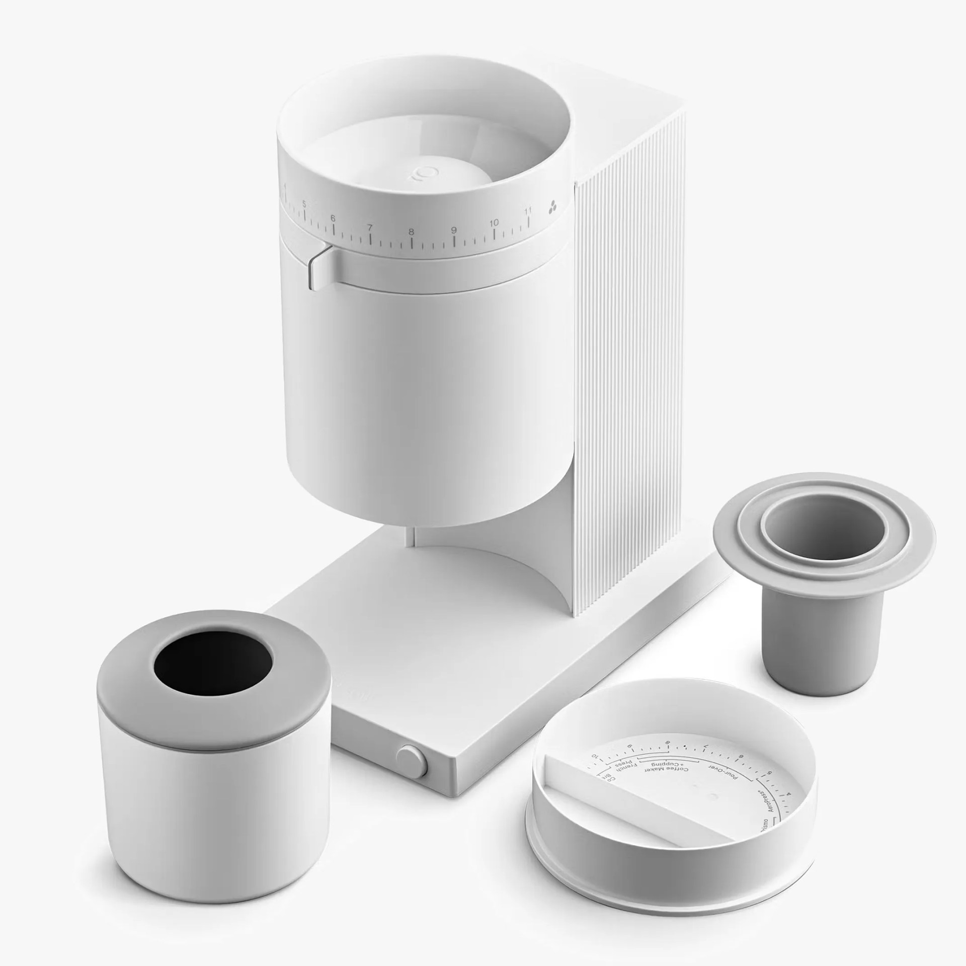 White modern coffee grinder with cylindrical hopper and three detachable parts on a white surface.