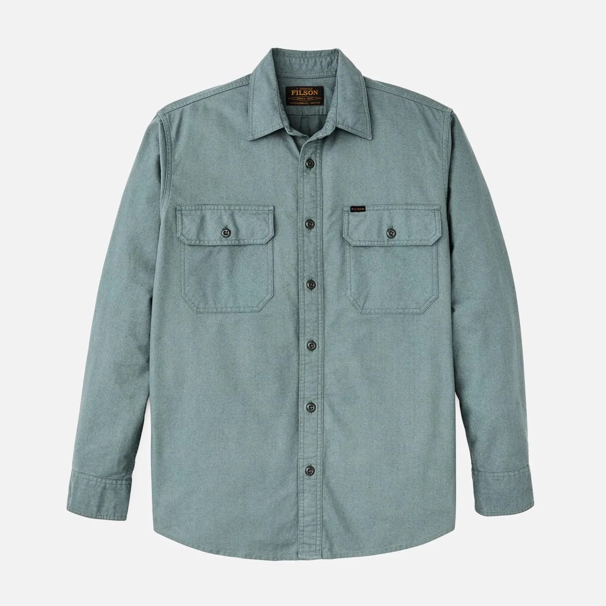 Light blue long-sleeve button-up shirt with two buttoned chest pockets and a collar.