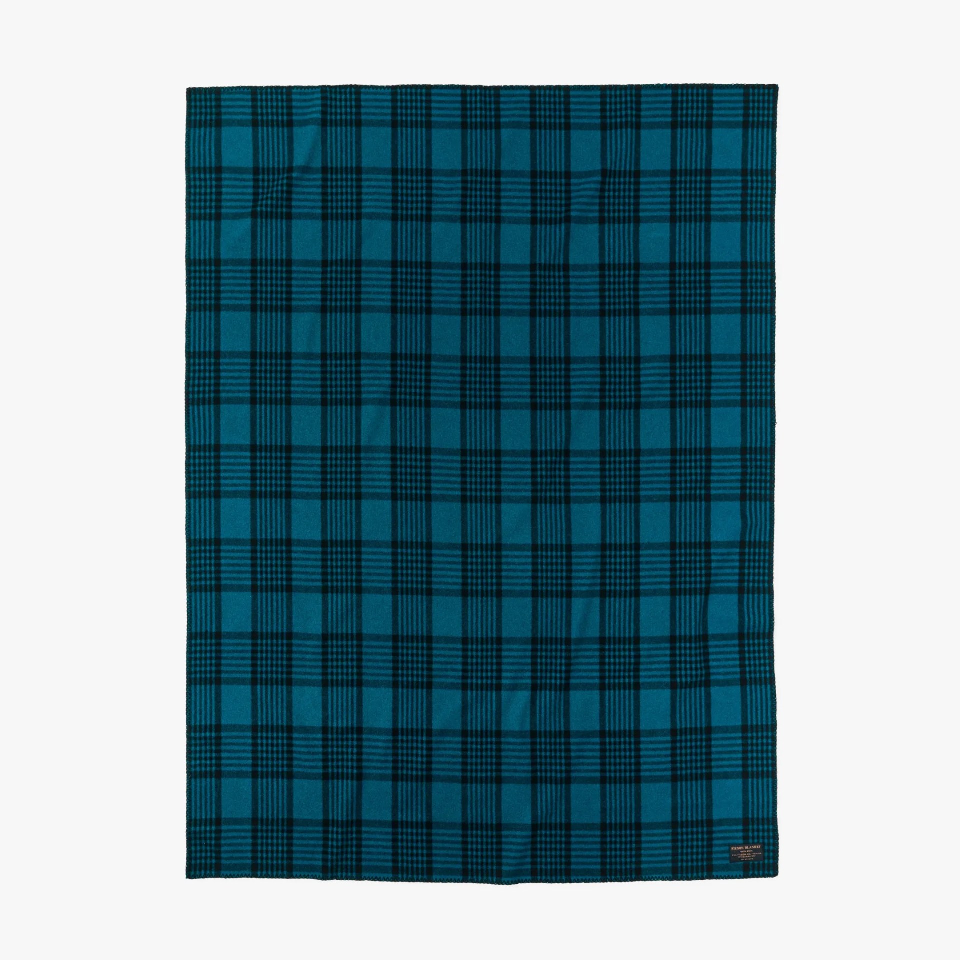 Blue and black plaid wool blanket with a small label in the bottom right corner.