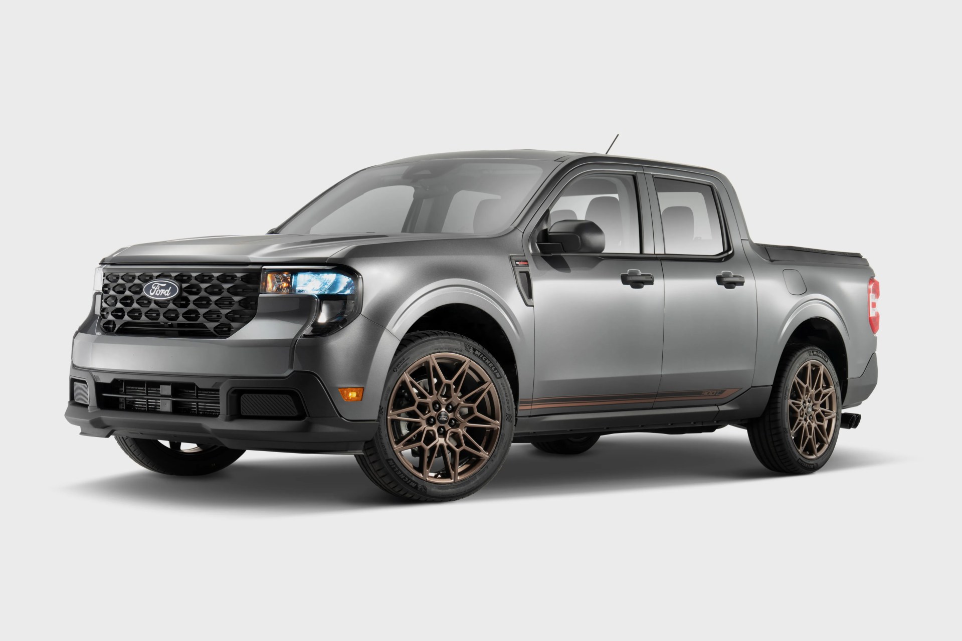 Gray Ford pickup truck with bronze multi-spoke wheels on a white background.